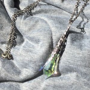 Silver necklace with opalescent crystal